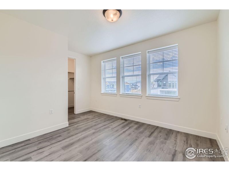 2nd upstairs bedroom includes a private full bath and walk-in closet.