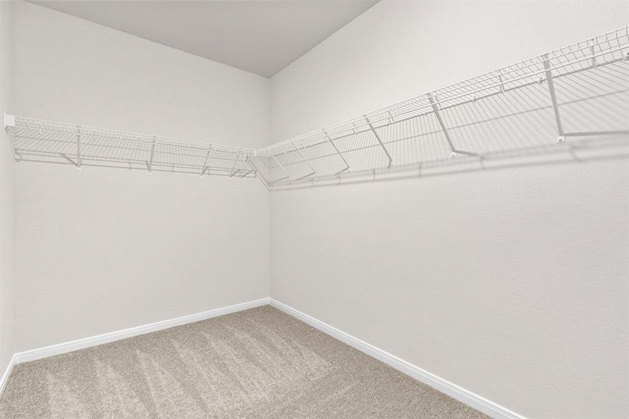 The large walk in closet in the master bedroom