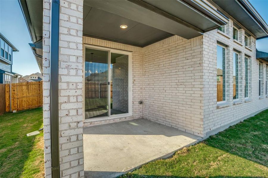 Exterior details and patio area of a home in West Crossing, Anna (Image 2).