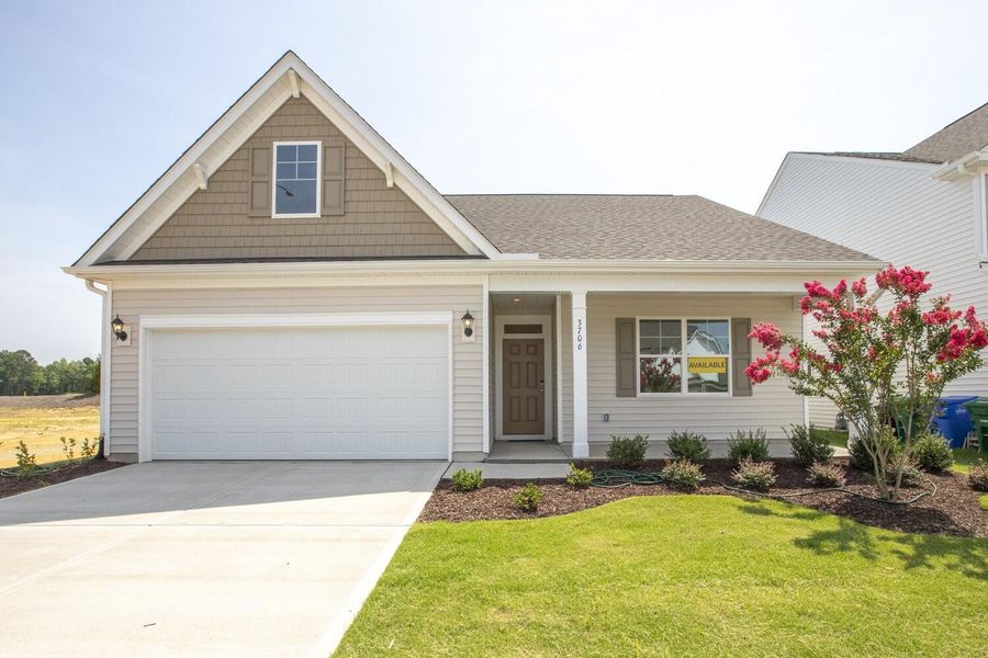 Front exterior of a new home in Parker's Preserve, Ridgeville, SC, highlighting curb appeal (Image 2).