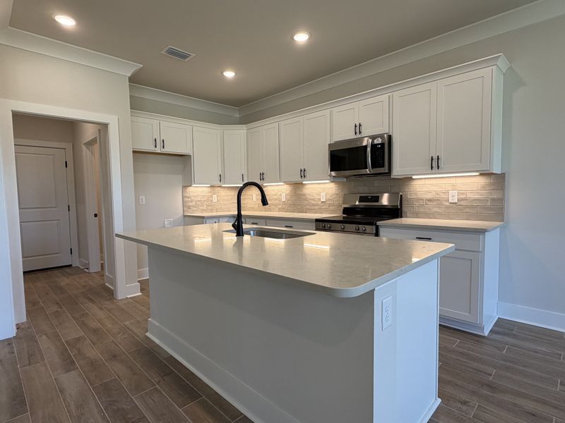 Furnished interior view inside a new home in Natureview, Freeport (Image 11).