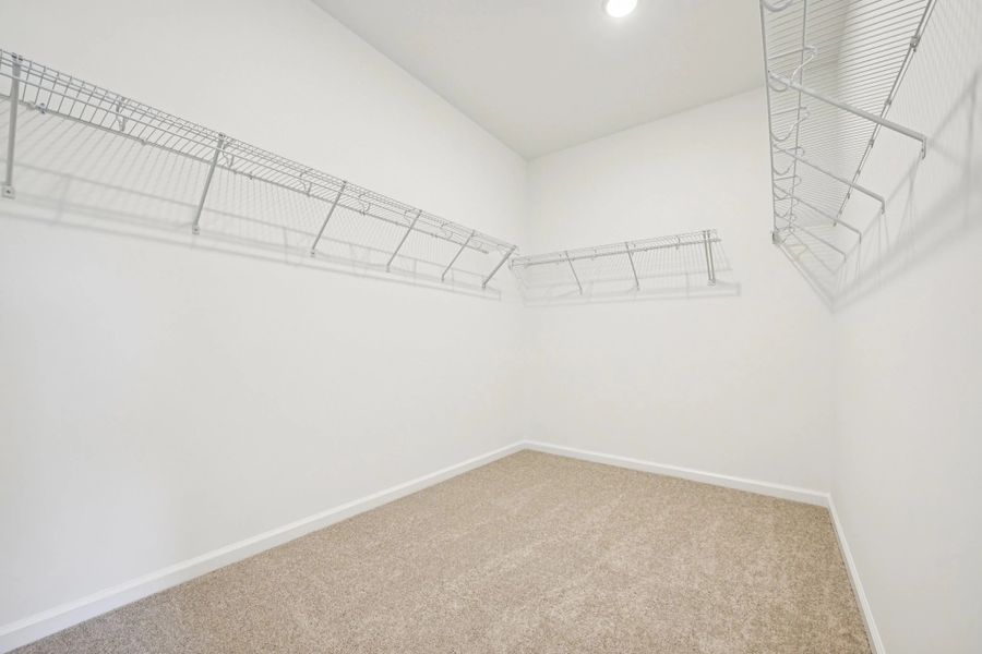 Primary Walk-In featuring the AW Collection® Artisan - Simple, spacious, and effortlessly styled.
