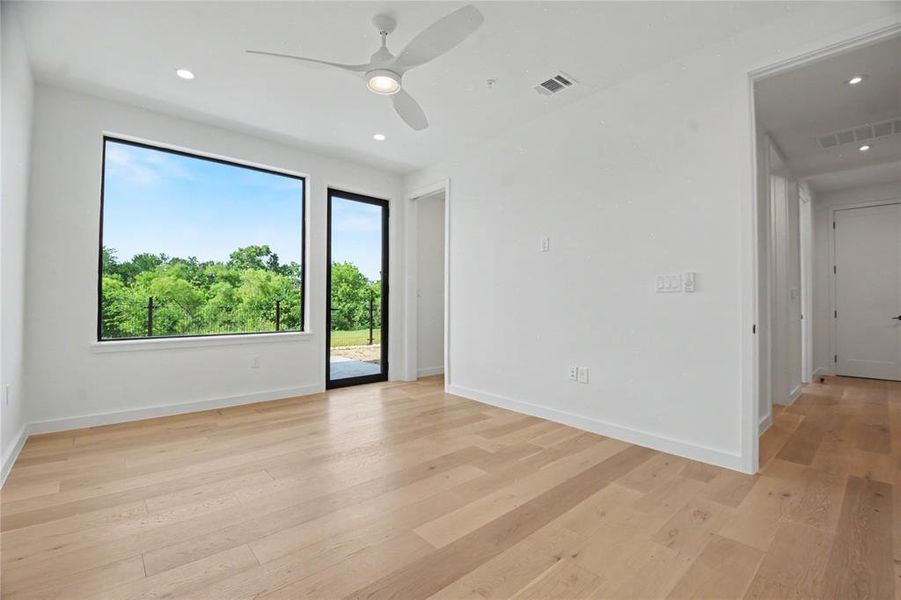 With an exterior door to the back patio facing the greenbelt.