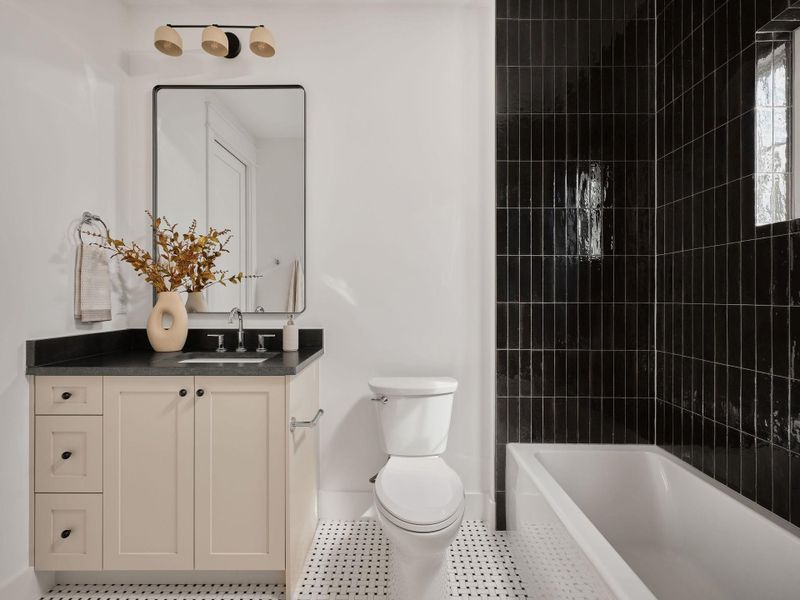 Bathroom featuring vanity and tub / shower combination Bathroom featuring vanity and tub / shower combination