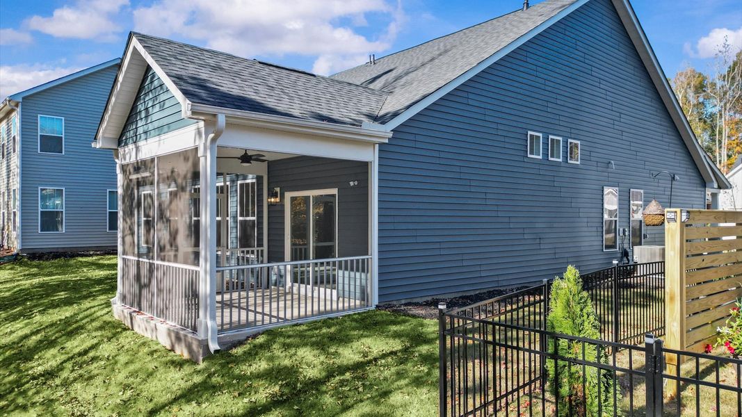Tasteful rear screened porch provides a peaceful retreat and effortless indoor-outdoor flow Tasteful rear screened porch provides a peaceful retreat and effortless indoor-outdoor flow