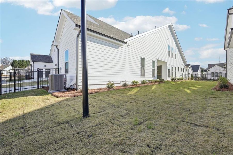 Exterior details and patio area of a home in Promenade at Sawnee Village, Cumming (Image 32).
