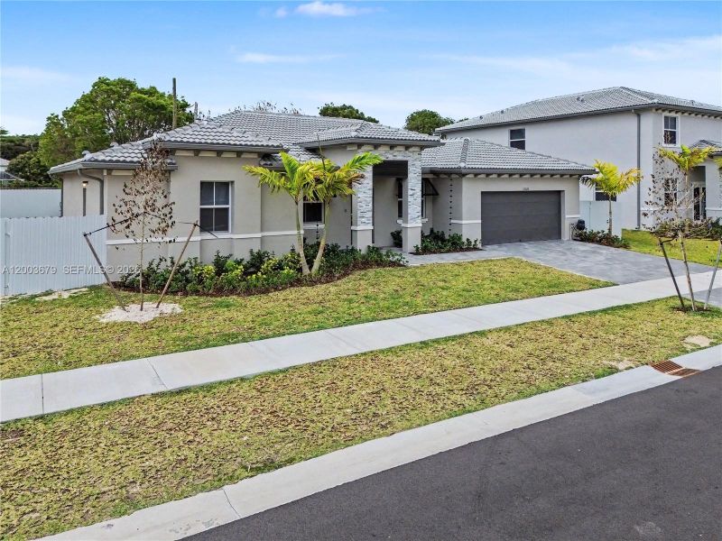 Front exterior of a new home in , Miami, FL, highlighting curb appeal (Image 22).