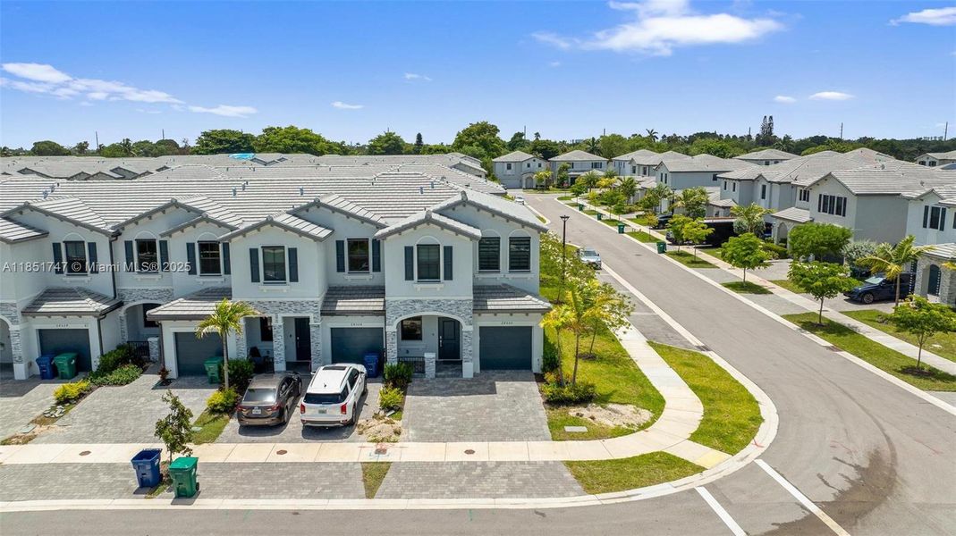 Front exterior of a new home in , Homestead, FL, highlighting curb appeal (Image 17).