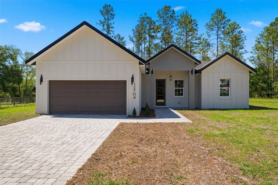 Front exterior of a new home in , Ocala, FL, highlighting curb appeal (Image 19). Front exterior of a new home in , Ocala, FL, highlighting curb appeal (Image 19).