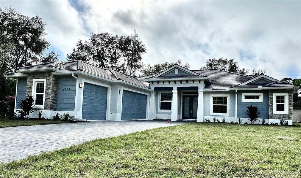Front exterior of a new home in , North Port, FL, highlighting curb appeal (Image 1).