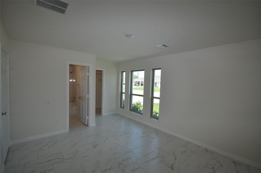 Front Bedroom is located off the kitchen and includes an en suite bath.  Works well for Mom or Dad, an at home office or a member of the family who needs a little extra care.