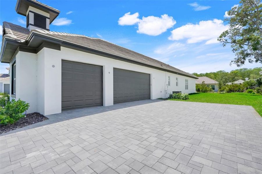 Front exterior of a new home in Toscana, Palm Coast, FL, highlighting curb appeal (Image 24).