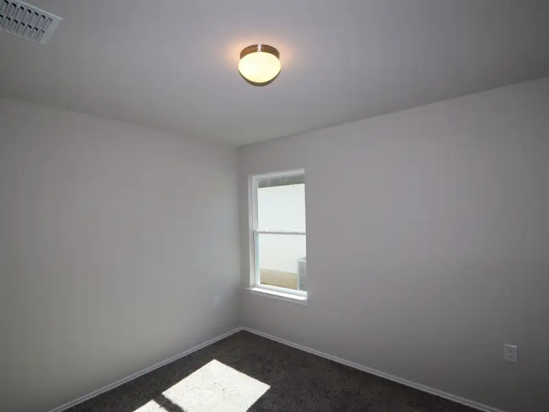 Spacious, unfurnished interior of a new home in Marble Creek Crossing, Austin (Image 10).