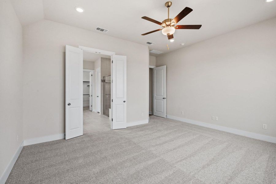 Primary Bedroom with elevated ceiling