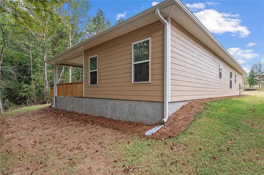 Exterior details and patio area of a home in Canterbury Villas, Carrollton (Image 16).