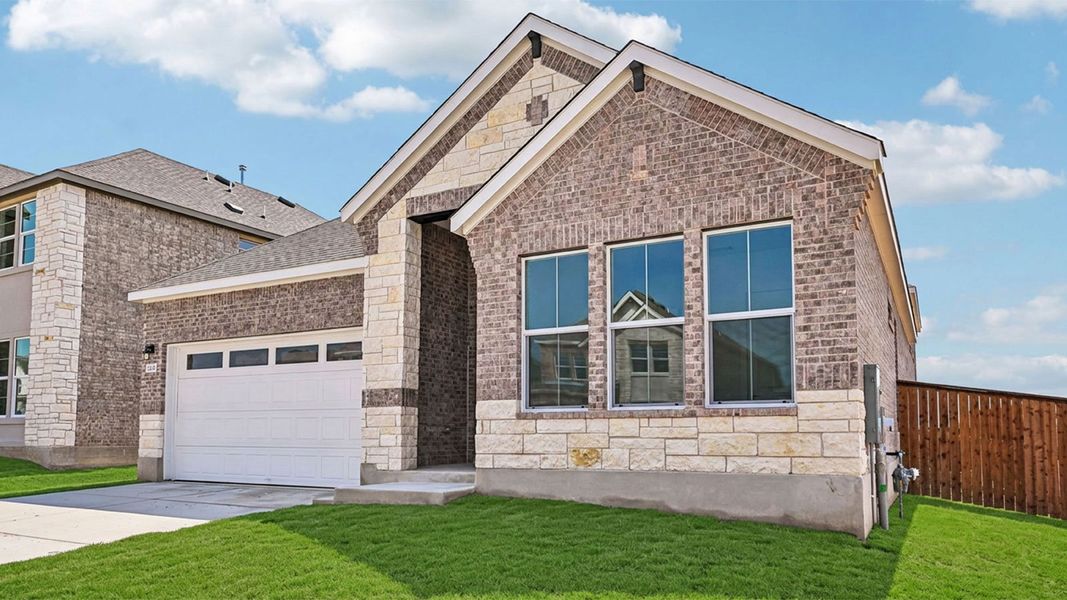 Front exterior of a new home in The Enclave at Bar W Ranch, Leander, TX, highlighting curb appeal (Image 28).
