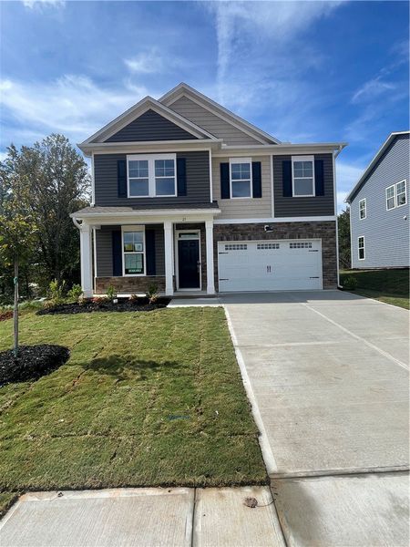 Front exterior of a new home in Springwood Grove, Central, SC, highlighting curb appeal (Image 1).