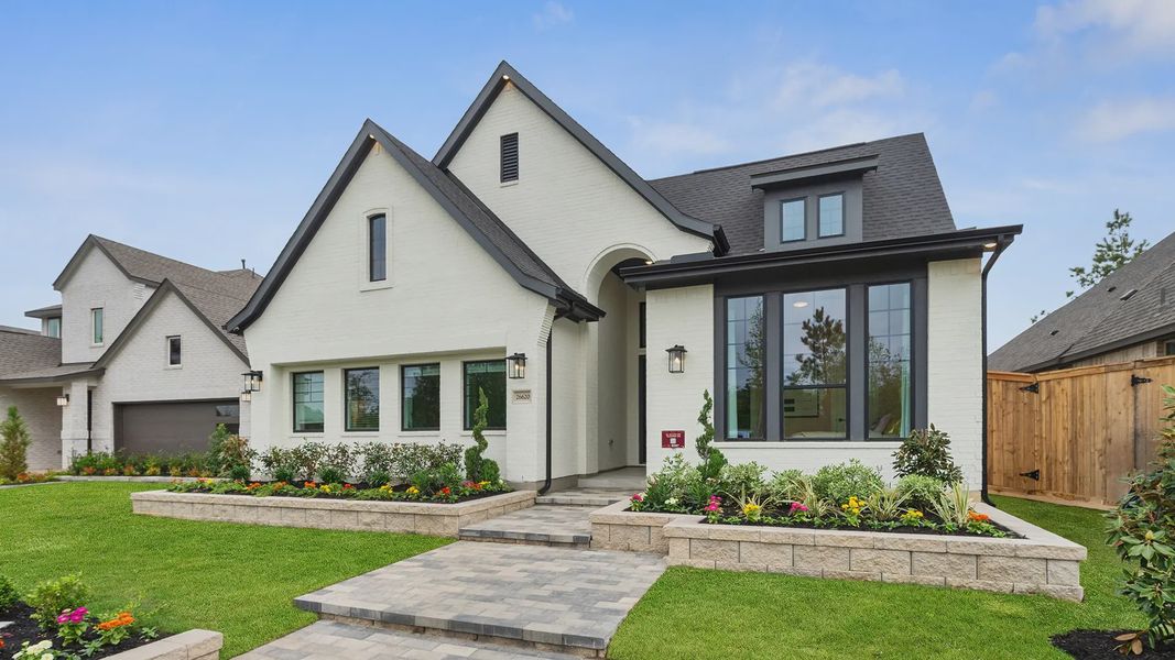 Representative exterior photo of a completed home built from the Hampton by Chesmar Homes in Wildrye 60', Waller, TX (Image 26).