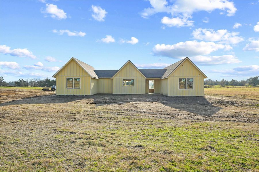 Thanks to the builder’s unique design, this under construction semi-custom modern farmhouse presents a visually appealing front elevation that is set apart from the rest. Three prominent gabled sections with board and batten siding, enhance the rustic yet contemporary charm. Thanks to the builder’s unique design, this under construction semi-custom modern farmhouse presents a visually appealing front elevation that is set apart from the rest. Three prominent gabled sections with board and batten siding, enhance the rustic yet contemporary charm.