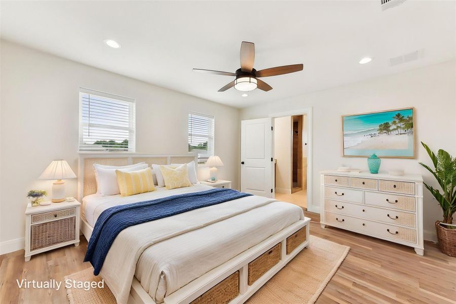 Bedroom with recessed lighting, light wood-style flooring, and visible vents Bedroom with recessed lighting, light wood-style flooring, and visible vents