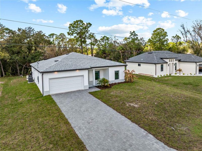Front exterior of a new home in , North Port, FL, highlighting curb appeal (Image 27).