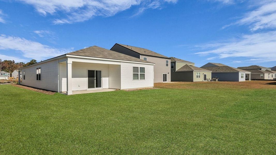 Exterior details and patio area of a home in Pine Hills at Cane Bay, Summerville (Image 23).