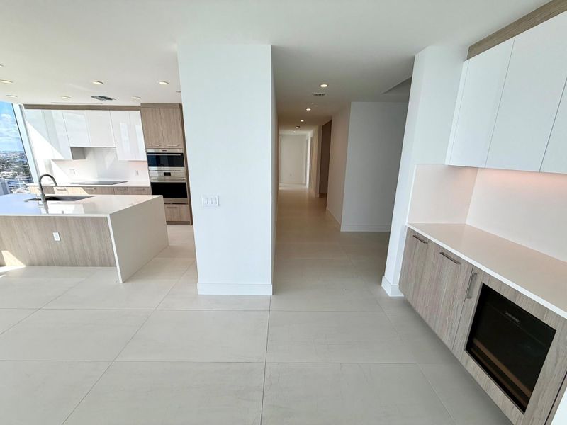 Kitchen, bar, and hallway