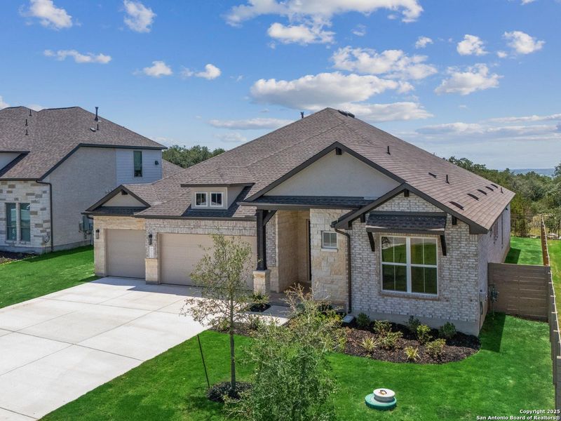 Front exterior of a new home in The Grove at Vintage Oaks, New Braunfels, TX, highlighting curb appeal (Image 18).