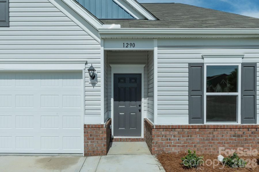Exterior details and patio area of a home in Country Club Village, Salisbury (Image 3).