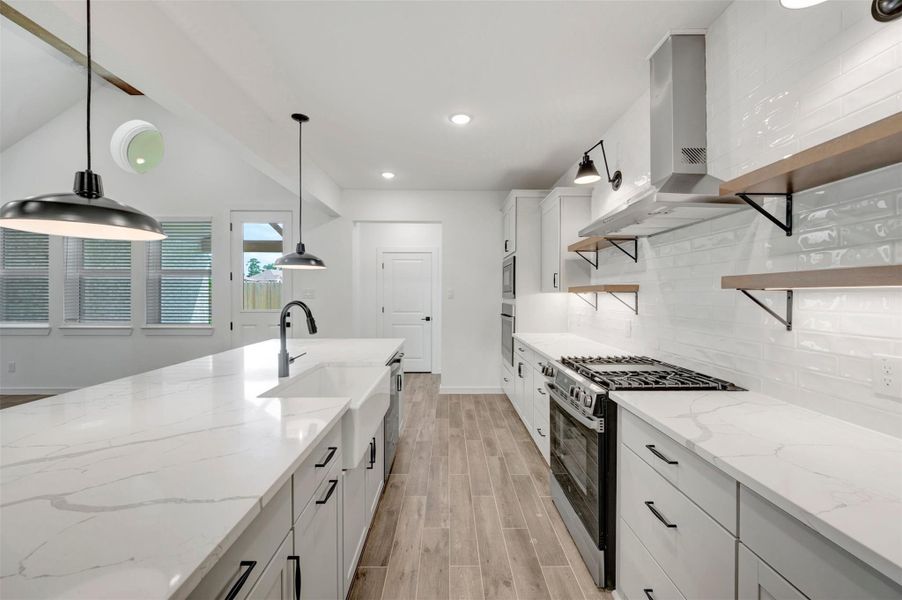 Stylish kitchen with pewter grey cabinets and decorative floating shelves