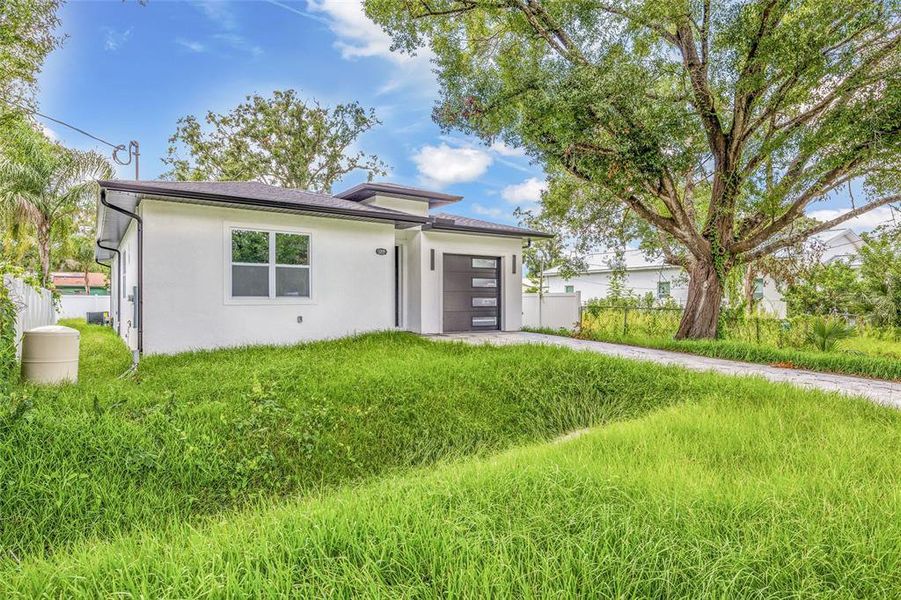 Front exterior of a new home in , Tampa, FL, highlighting curb appeal (Image 23).