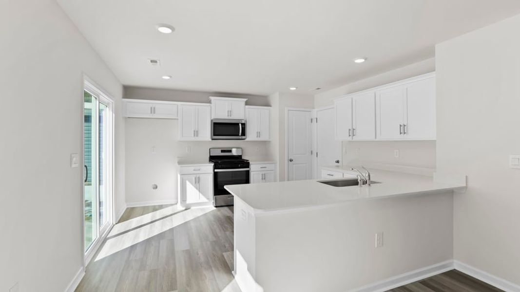 Furnished interior view inside a new home in Village Grove, Greenville (Image 7).