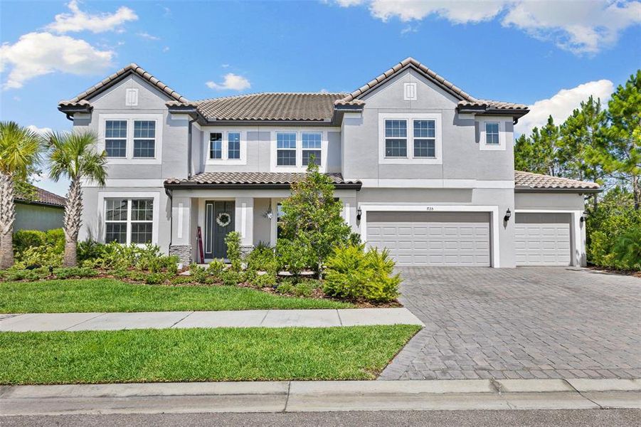Front exterior of a new home in , Wesley Chapel, FL, highlighting curb appeal (Image 1). Front exterior of a new home in , Wesley Chapel, FL, highlighting curb appeal (Image 1).