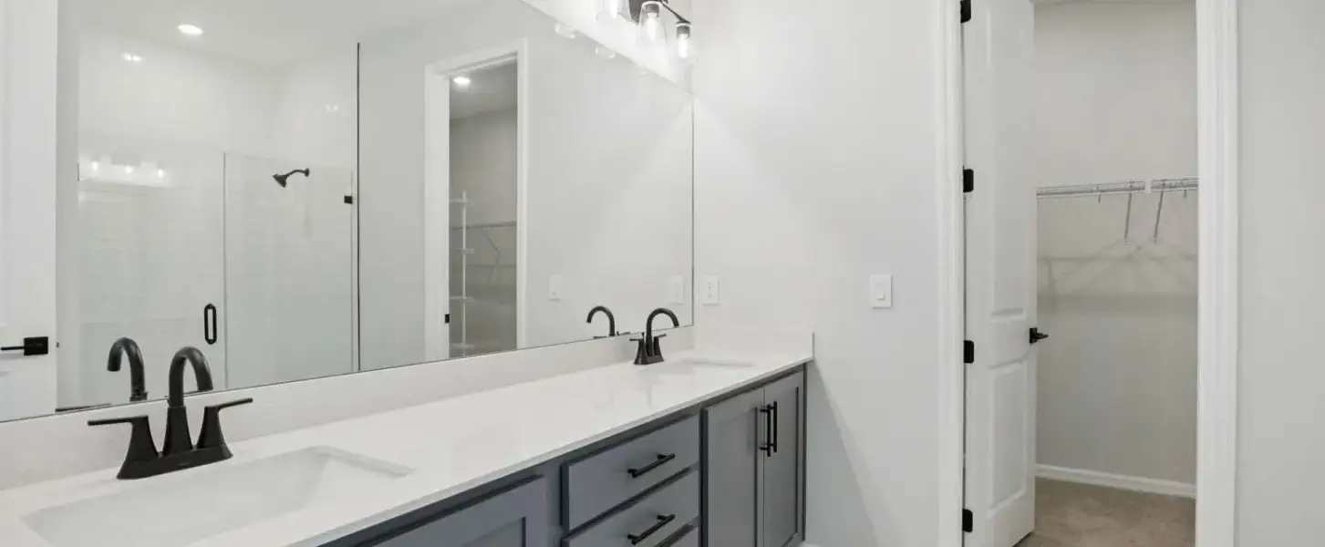 Primary bathroom featuring double sinks and plenty of cabinets will feature aspects of AW Collection® Serene - Representative images and renderings are for illustrative purposes. Actual structural options and design finishes of home may vary.