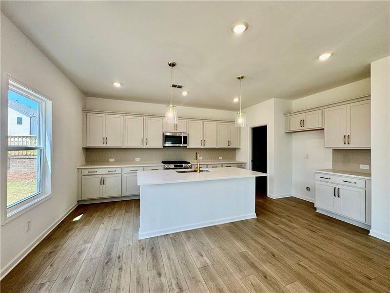 Furnished interior view inside a new home in Eastlyn Crossing, Flowery Branch (Image 7).