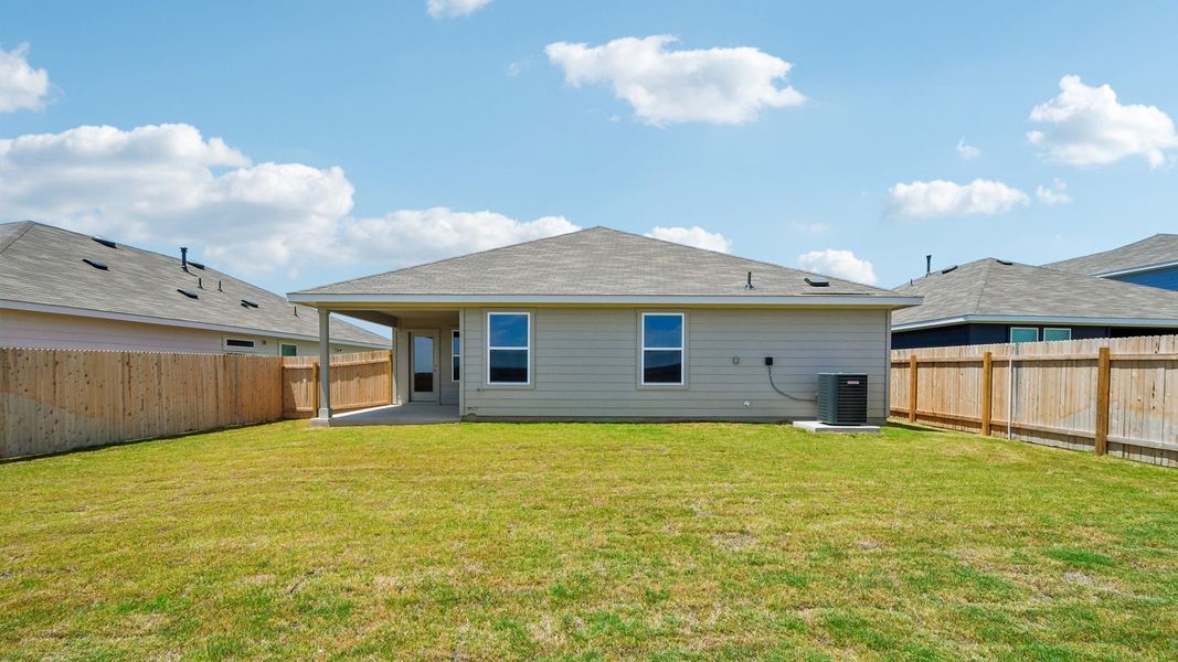 Exterior details and patio area of a home in Carillon, Manor (Image 21).