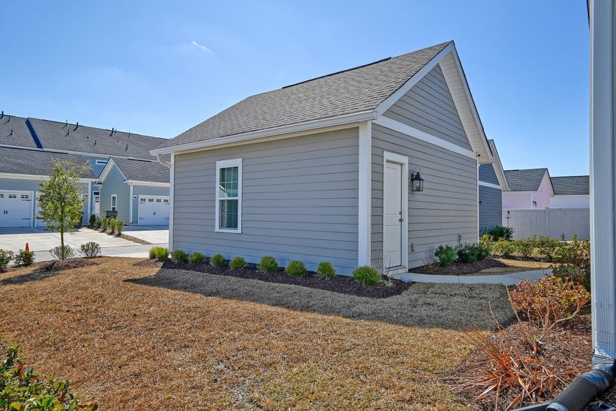Exterior details and patio area of a home in Midtown at Nexton, Summerville (Image 27).