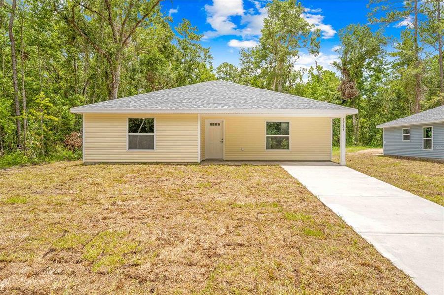 Front exterior of a new home in , Brooksville, FL, highlighting curb appeal (Image 2).