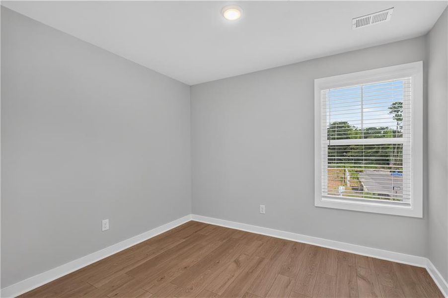 Spacious, unfurnished interior of a new home in The Cottages at East Lanier, Fayetteville (Image 21).