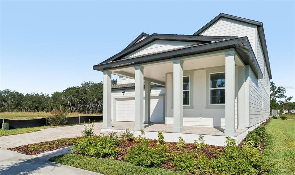 Front exterior of a new home in Northlake Traditional, Winter Garden, FL, highlighting curb appeal (Image 25).