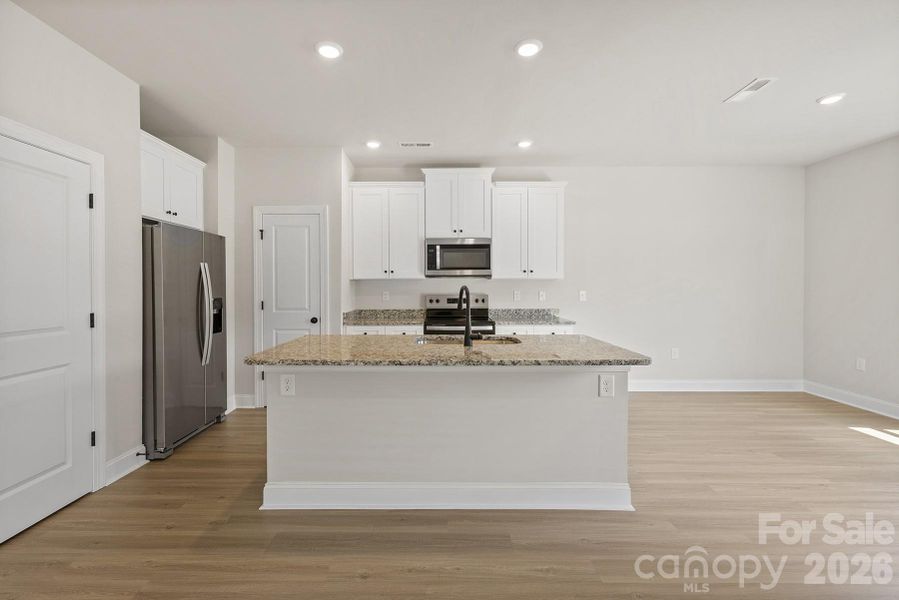 Furnished interior view inside a new home in Stagecoach Station, Gastonia (Image 4).