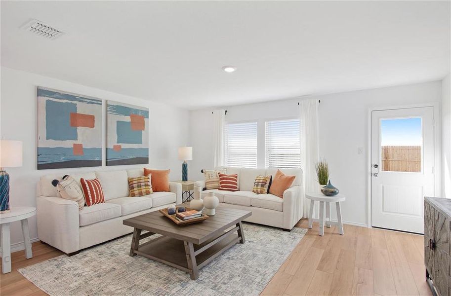 Living room with light hardwood / wood-style flooring