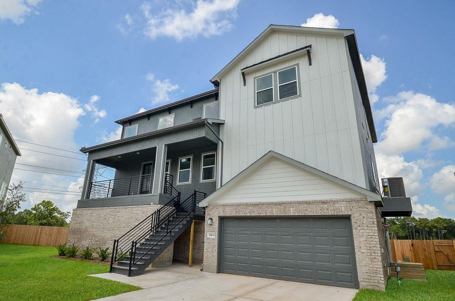 The long driveway leads to a two-car garage, providing ample parking. The long driveway leads to a two-car garage, providing ample parking.
