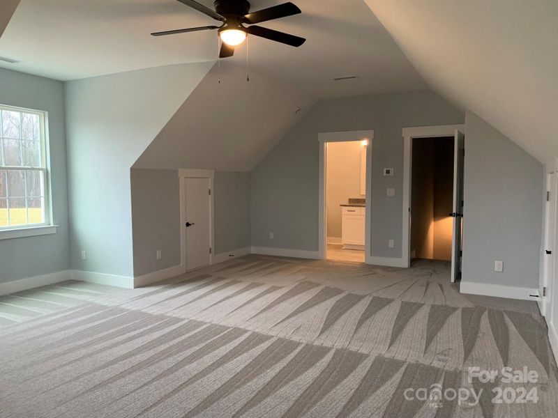 Bonus Room with large 1/2 bath, linen closet, walk in closet, and attic space