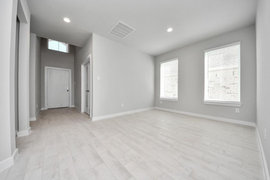 Make memories gathered around the table with your family and friends! This spacious dining room features elegant flooring, custom paint, and adjacent to family room and kitchen for open concept feel. Sample photo of completed home with similar floor plan. Actual colors and selections may vary. Make memories gathered around the table with your family and friends! This spacious dining room features elegant flooring, custom paint, and adjacent to family room and kitchen for open concept feel. Sample photo of completed home with similar floor plan. Actual colors and selections may vary.
