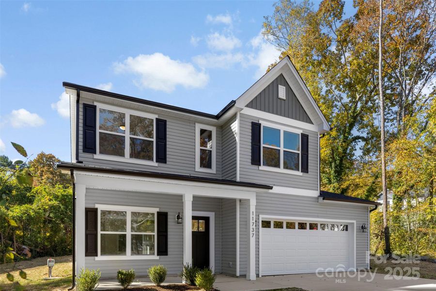 Front exterior of a new home in , Huntersville, NC, highlighting curb appeal (Image 19).