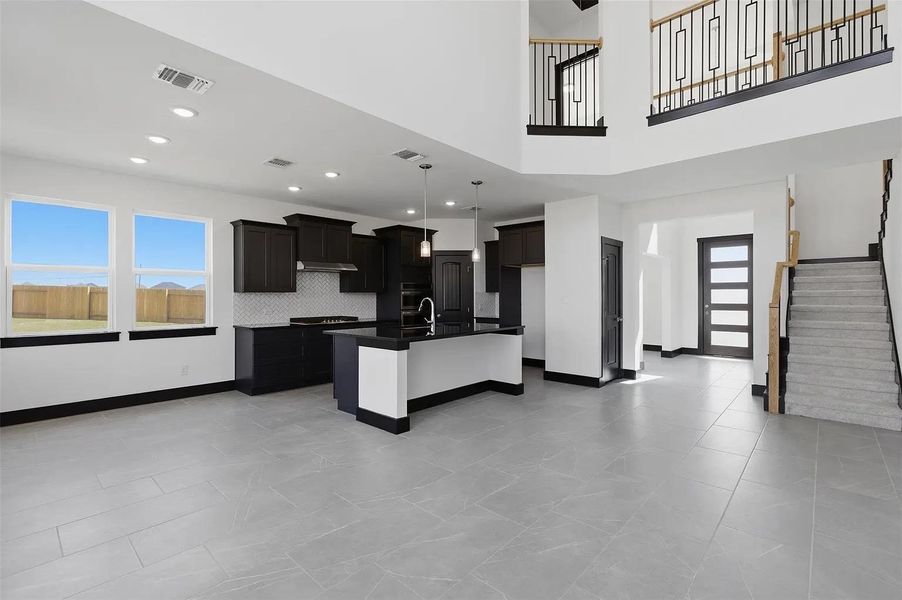 A grand entrance with an open-concept living space and a modern kitchen await. A grand entrance with an open-concept living space and a modern kitchen await.