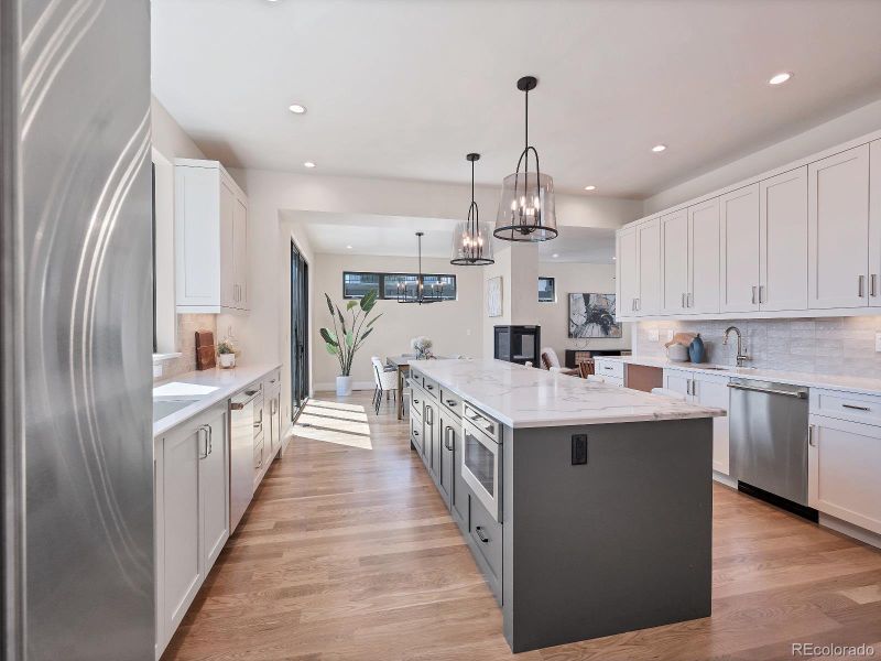 Wide walkway allows easy flow, abundant cabinets and drawers for storage