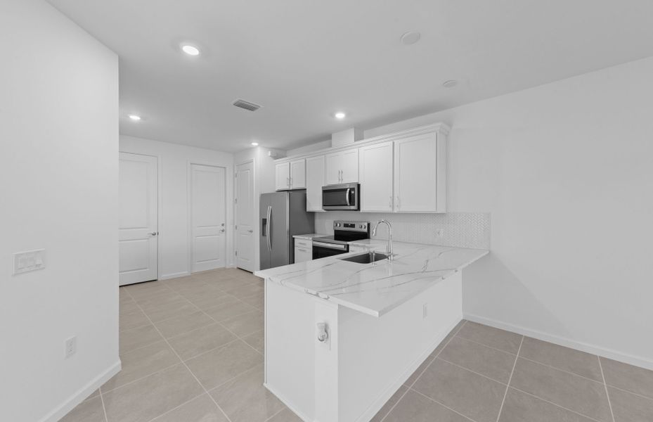 Furnished interior view inside a new home in Del Webb Naples, Ave Maria (Image 11).