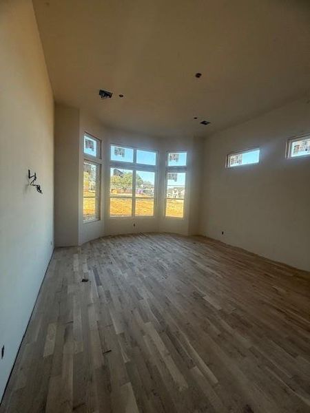 Primary bedroom will feature white oak beams, bay windows, hard wood floors and beautiful natural light.